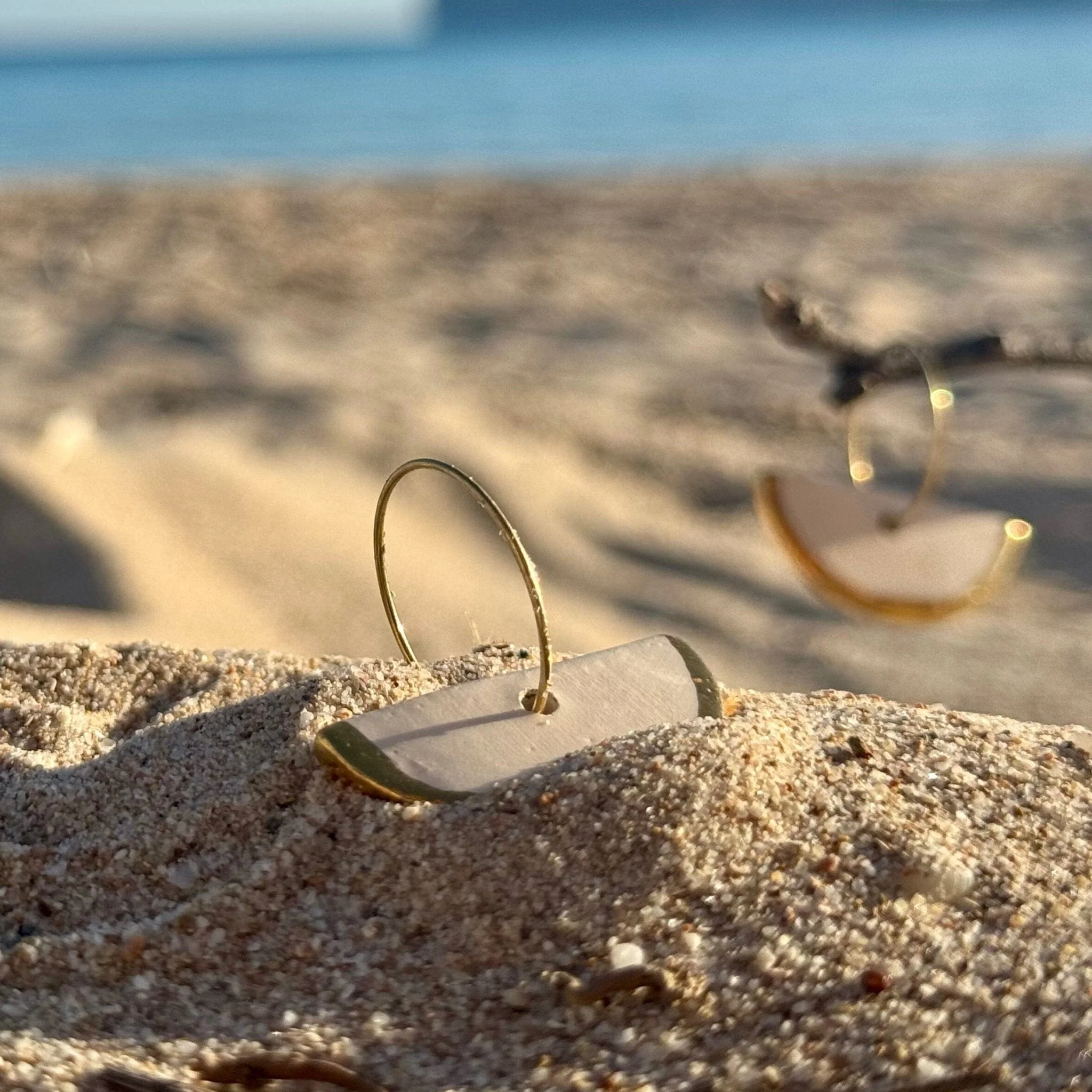 Doraluna | Handcrafted white ceramic dangle earrings with gold luster - Image 3
